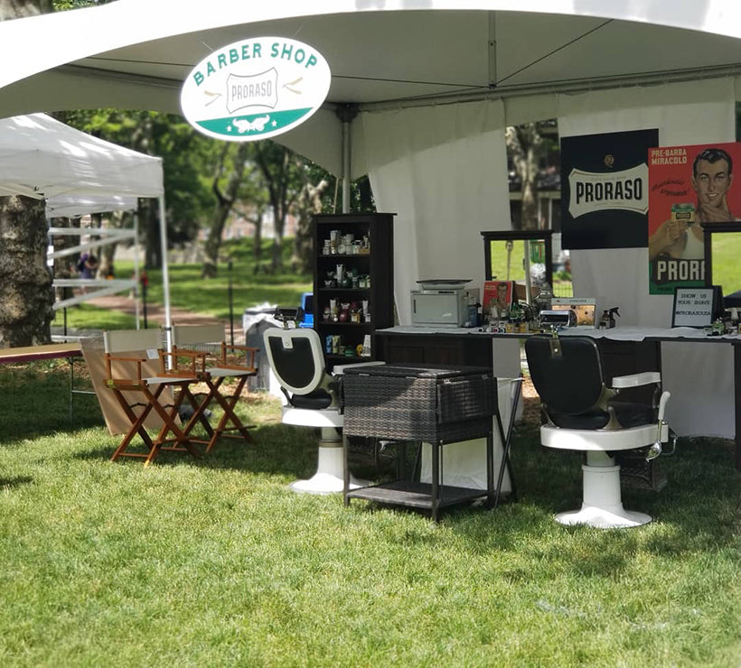 Proraso mobile barbershop setup, two barber chairs and merchandise
