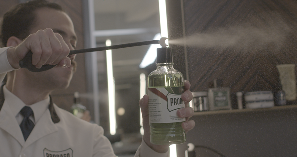 Michael Haar mists a client with Proraso after shave lotion at Haar & Co Barbershop