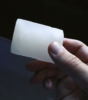 Post-Shave Stone being held in hand